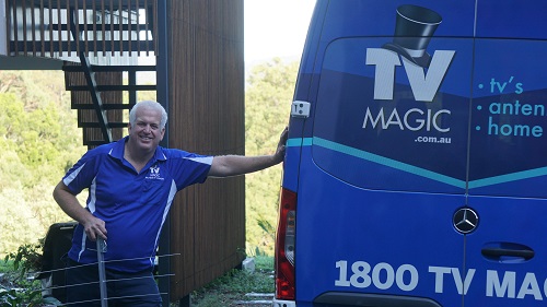 Technician - Steve, standing next to TV Magic van with antenna