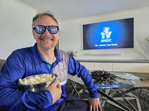 Technician with a bowl of popcorn