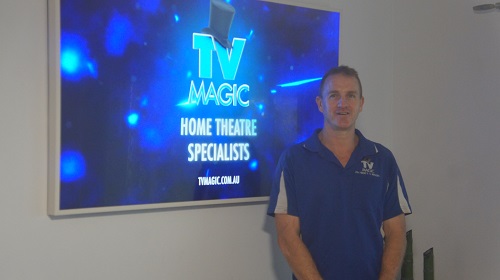 Brent in front of a large screen