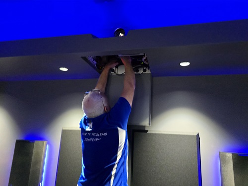 Technician - Steve, installing a motorised projector