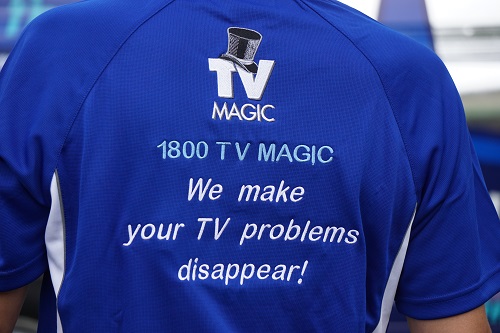 technician with back of shirt facing outwards
