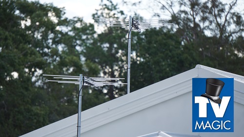 aerial installation on a tin roof. TV Magic logo in bottom right corner