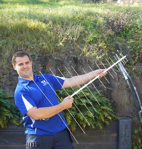 Technician holding an antenna