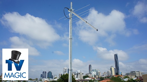 an antenna installation with city in background. TV Magic logo in bottom left corner