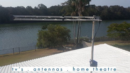 Antenna installation by TV Magic. Caption at bottom - TV's, antennas, home theatre