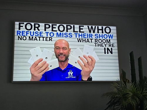 Technician holding tv points. Caption " For people who refuse to miss their favourite show no matter what room they're in."
