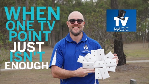 Technician holding a handful of TV points. Logo in top right hand corner.