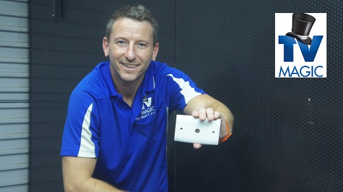 Jim holding a TV point ready for installation. Also a TV Magic logo in top right corner