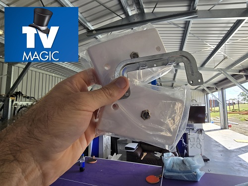 Technician holding up a new TV point. Logo in top left corner