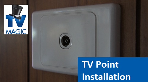 a freshly installed TV point on a plaster wall, with a TV Magic logo in top left corner and a caption in bottom right which says TV point installation