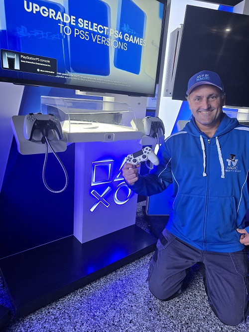 Technician with a commercial gaming console setup