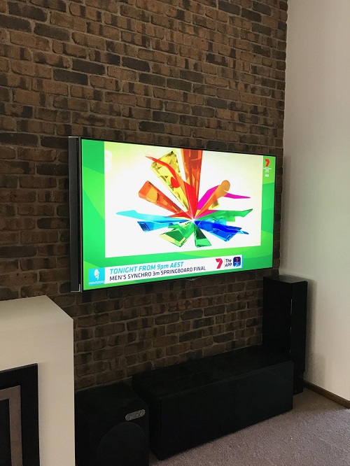 A wall mounted TV by TV Magic