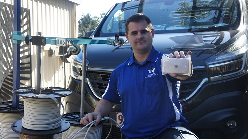 Technician holding up a TV point