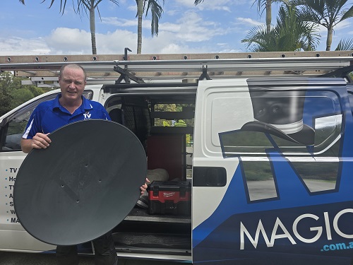 Technician with satellite dish