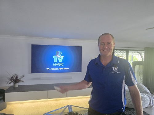 Ben with a TV he tuned and setup in Harristown.