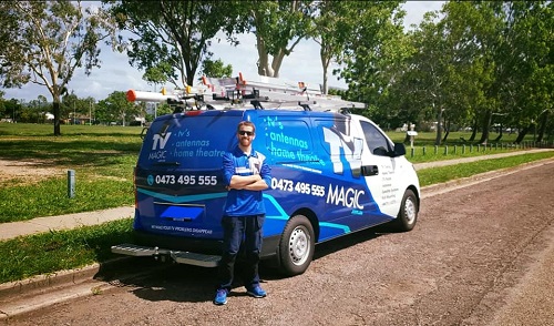 Technician - Gordon, standing behind his van