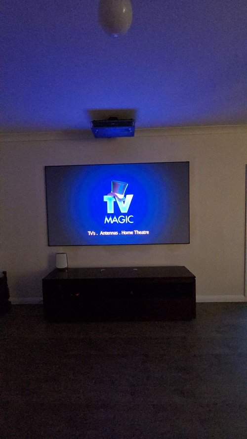 Wall mounted TV with logo on screen
