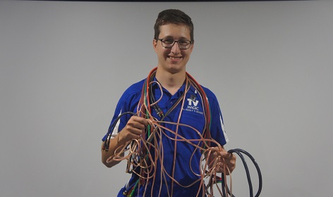 Technician tangled in messy cables